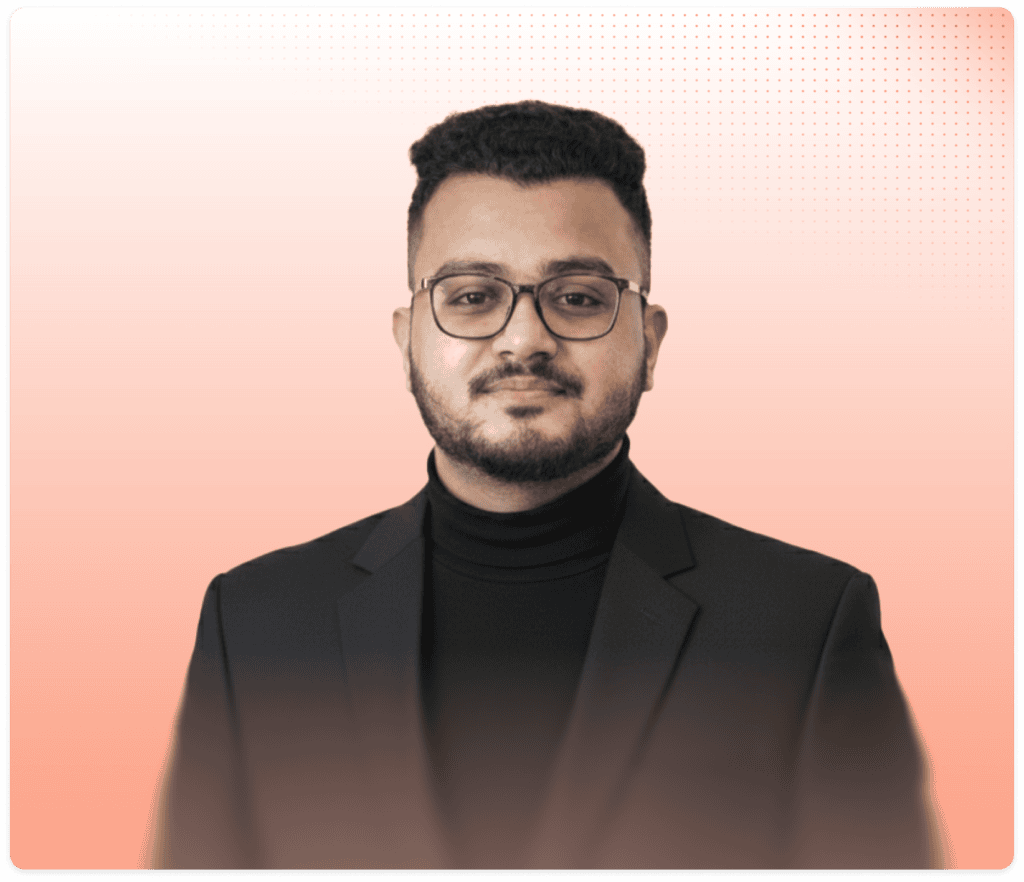Professional portrait of Ashfakuzzamn Nayeem in a black suit and glasses.